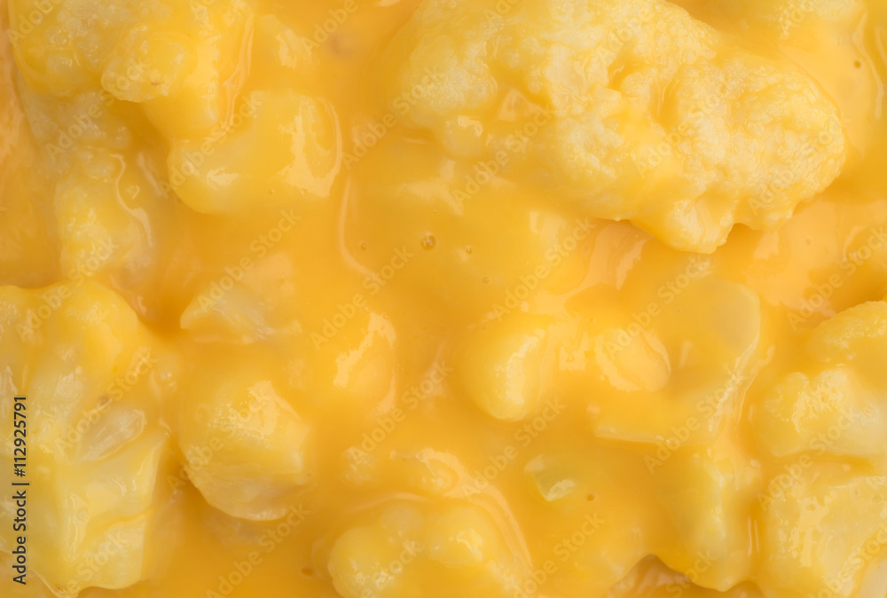 Close view of cauliflower in a cheese sauce Close view of cauliflower in a cheese sauce