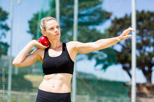 Bilde på lerret Female athlete preparing to throw shot put ball