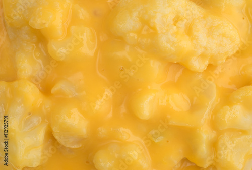Close view of cauliflower in a cheese sauce