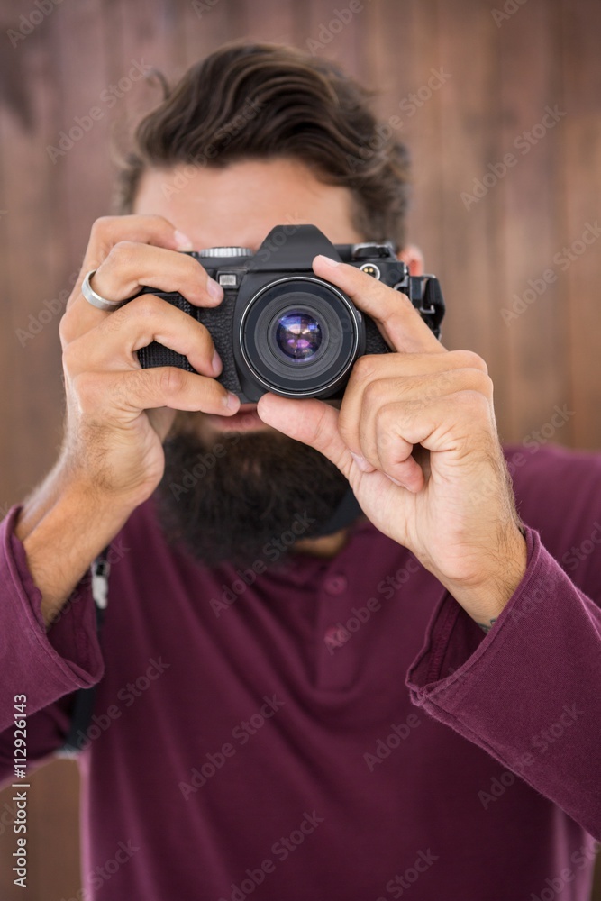 Hipster man taking picture