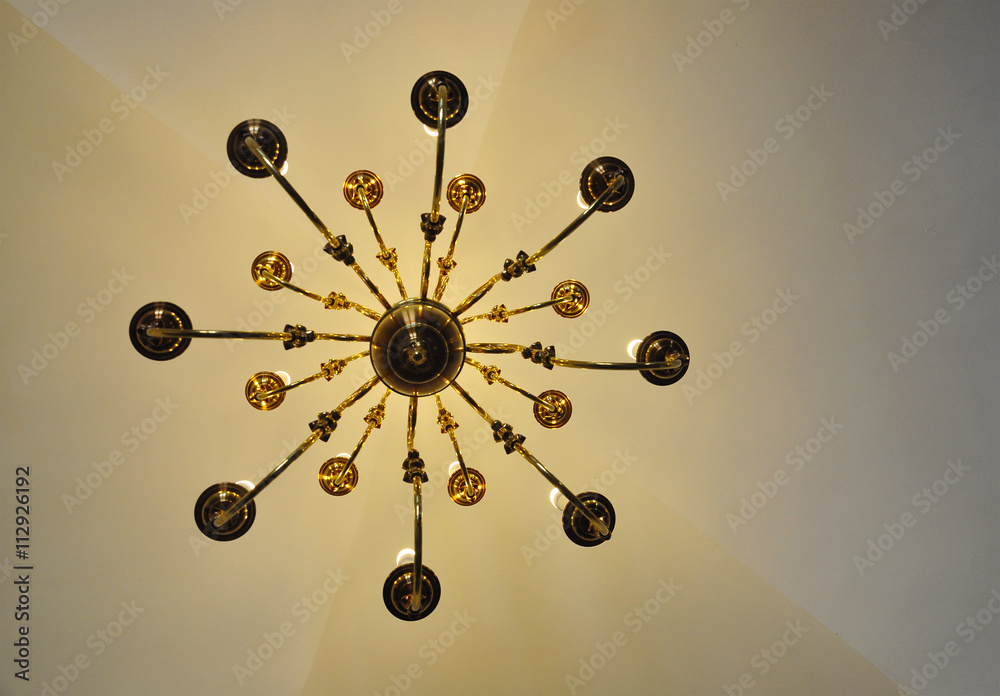 Obraz premium chandelier vintage, view from below, natural lights, old ceiling background