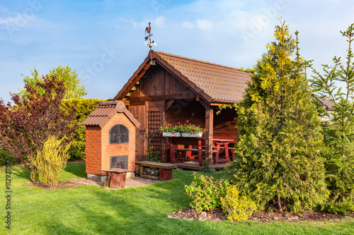 Εκτύπωση καμβά Landscaped summer garden with barbecue and wooden summerhouse