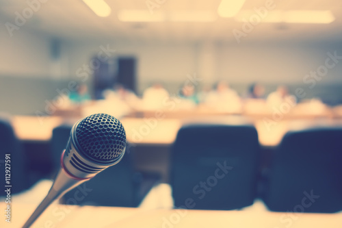 Black microphone in conference room ( Filtered image processed v photo