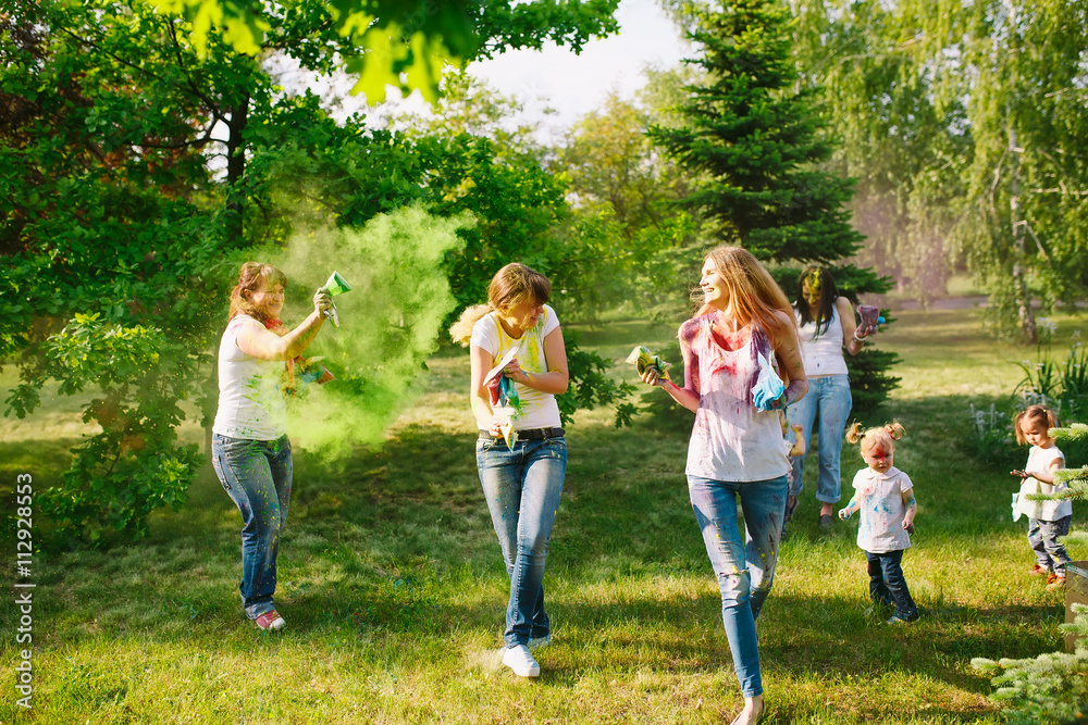 Fototapeta premium European people celebrate Indian holi festival with colorful pai