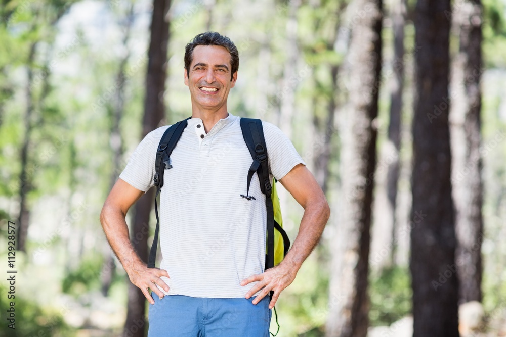 Man smiling and posing with his hands on hips Man smiling and posing with his hands on hips
