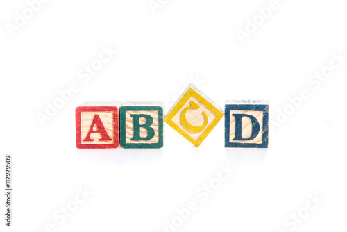 photo of a alphabet blocks spelling ABCD isolate on white backgr