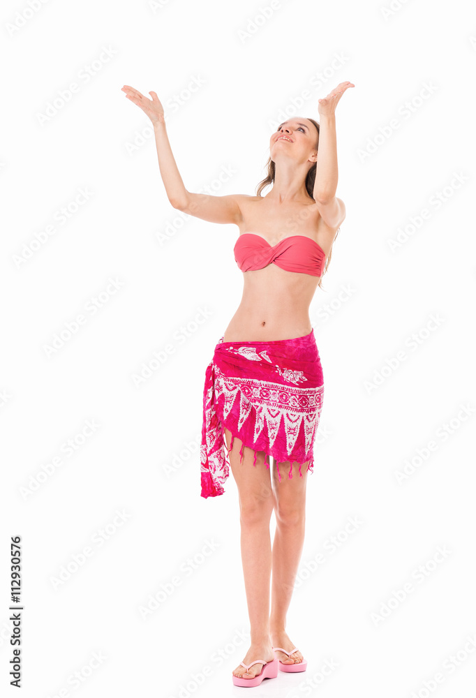 Sexy young woman posing in a bikini, isolated on white background Sexy young woman posing in a bikini, isolated on white background