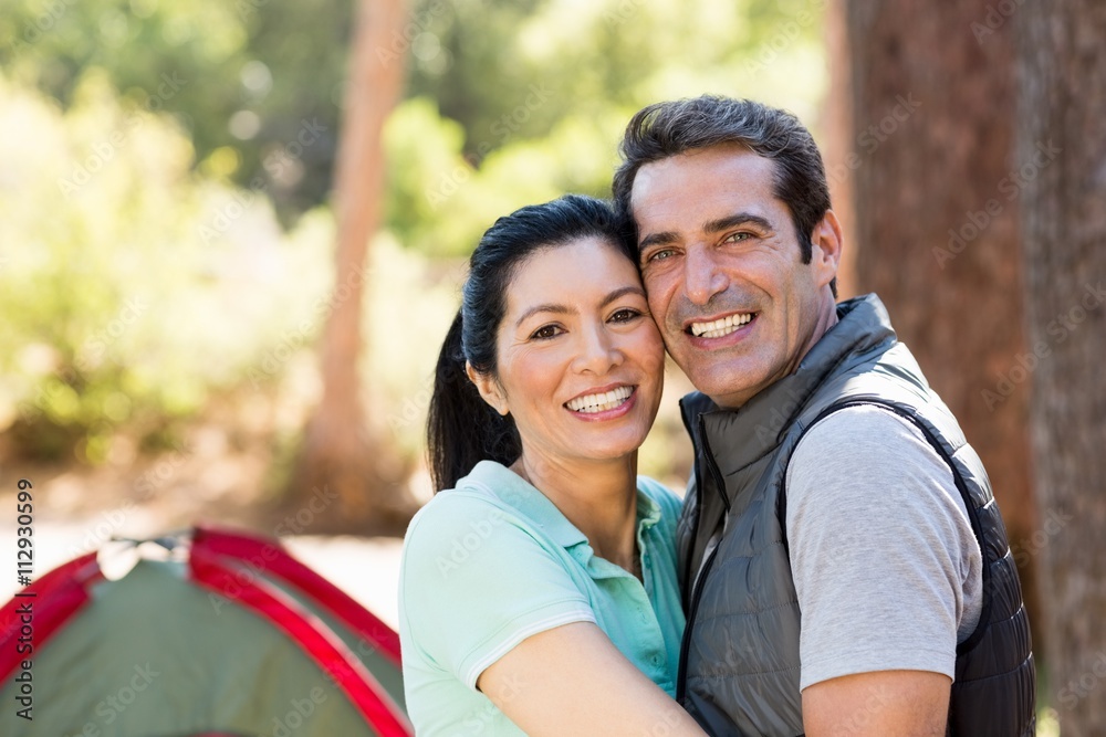 Fototapeta premium Portrait of couple smiling and holding each other