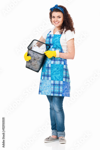 Young housewife with lots of discarded paper, isolated on white background