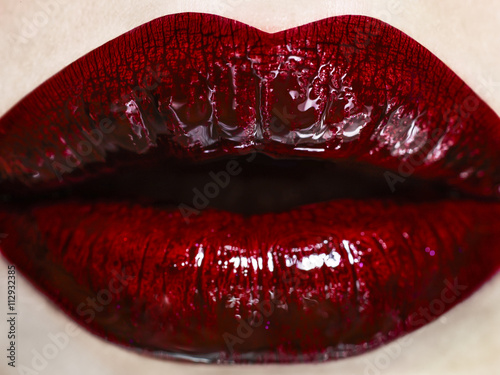 Close up of woman's mouth wearing red lipstick photo
