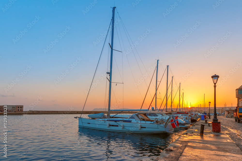 Old harbour with fishing boats and marina of Chania at dawn, Crete, Greece