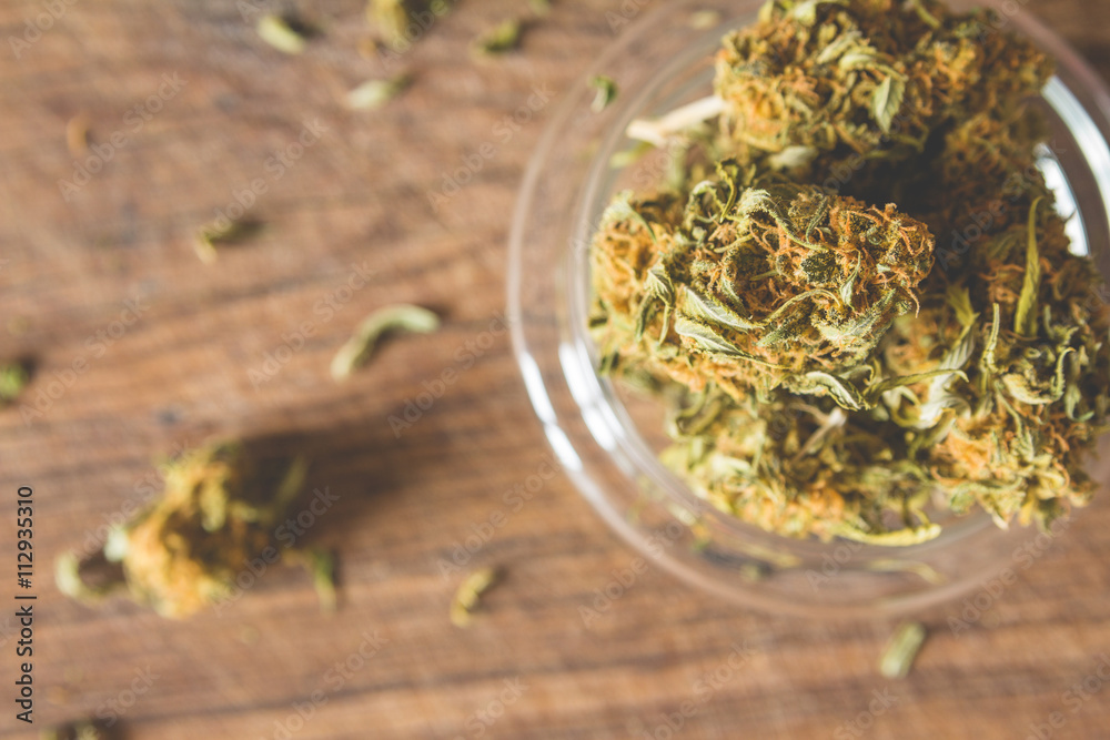 Marijuana buds in the glass plate