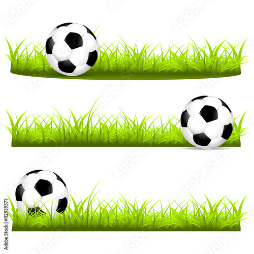 Set with soccer balls on a grass