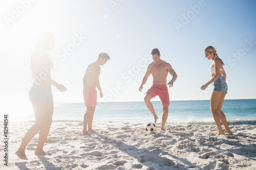 Friends playing football