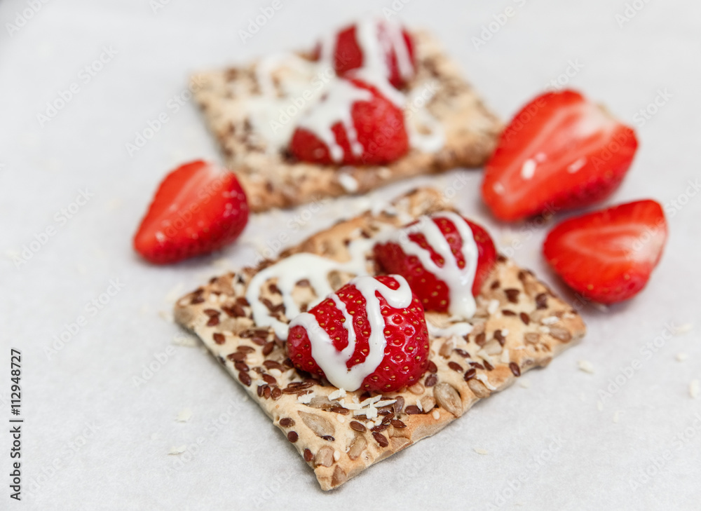 Red Fresh Strawberries are on the Cracker with Grains,Condensed Milk on the White Paper.Breakfast Organic Healthy Tasty Food.Cooking Vitamins Ingredients.Summer Fruits. Red Fresh Strawberries are on the Cracker with Grains,Condensed Milk on the White Paper.Breakfast Organic Healthy Tasty Food.Cooking Vitamins Ingredients.Summer Fruits.