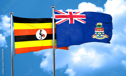 Uganda flag with Cayman islands flag, 3D rendering photo