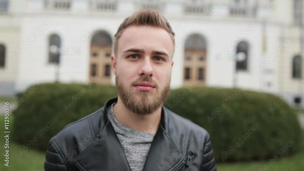 Young handsome man with deep grey eyes looking on a camera. Young handsome man with deep grey eyes looking on a camera.