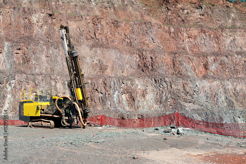 Driller in an open pit mine