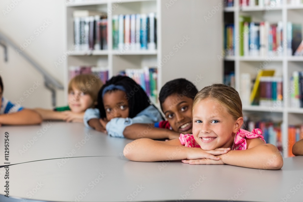 Pupils posing for the camera at desk Pupils posing for the camera at desk