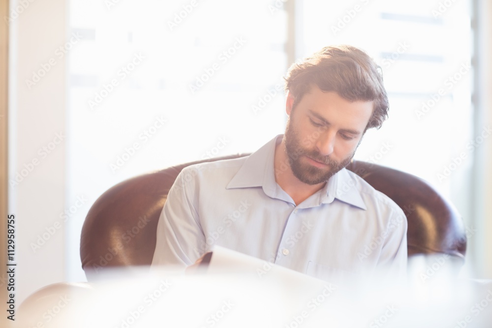 A businessman taking notes A businessman taking notes