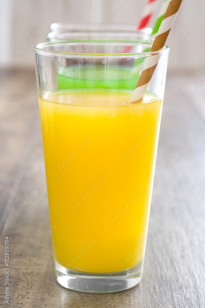 Fresh fruit smoothies on a rustic wooden table

