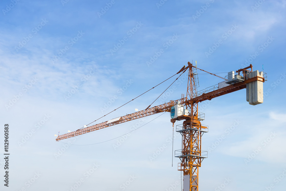 Antenna tower,antenna tower building with the blue sky.Close-up of the antenna building with the sky background.Communication antenna tower with the sky background in close-up scene.