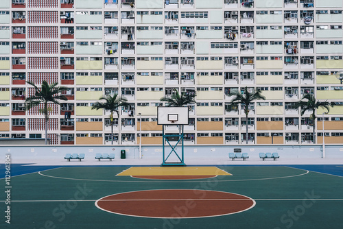 Urban Oasis - Basketball court on a pastel skyscraper front. photo