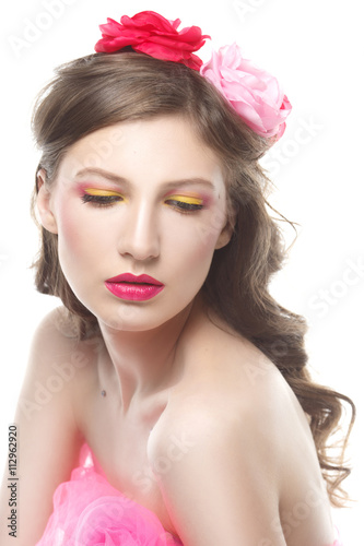 Gentle portrait of a girl with lids in pink isolated on white background
