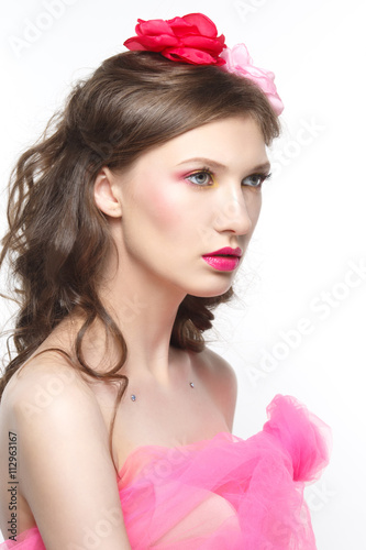 Gentle portrait of a girl in pink isolated on white background