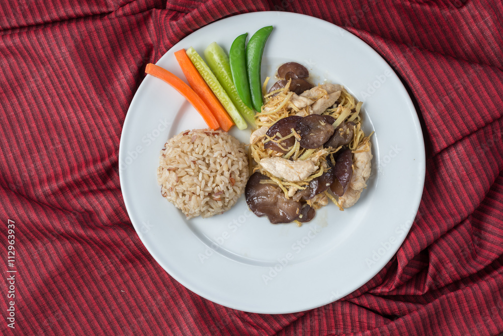 Food series : Stir fry chicken breast with ginger, served with brown rice and fresh vegetable, Thai foods