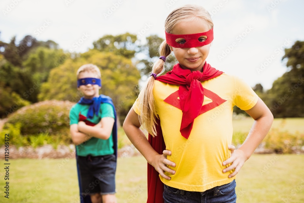 Children wearing superhero costume posing for camera Children wearing superhero costume posing for camera