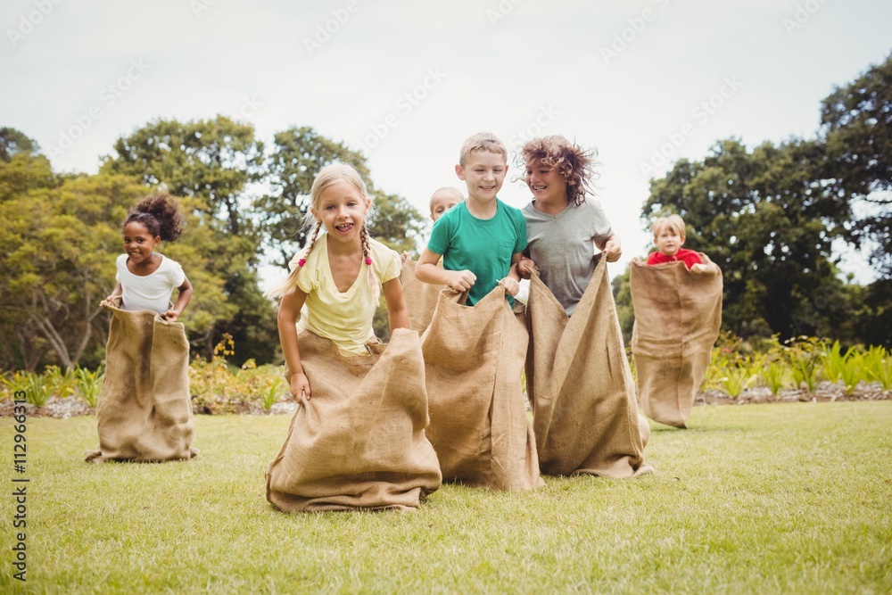 Obraz premium Children having a sack race