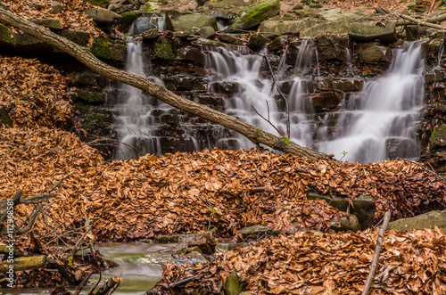 Waterfall on Mosorny creek, Beskid Zywiecki mountain range in Polish Carpathian Mountains photo