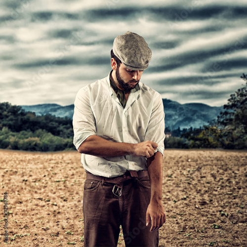 Canvas Print Farmer of the late nineteenth century shorten the sleeves.
