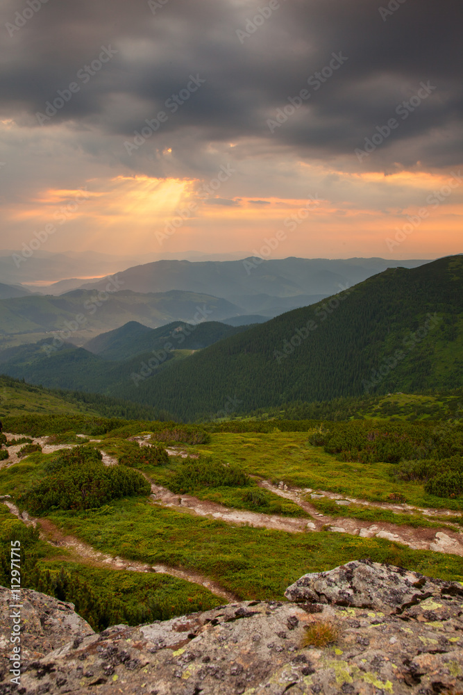 Naklejka premium Sunset in mountains