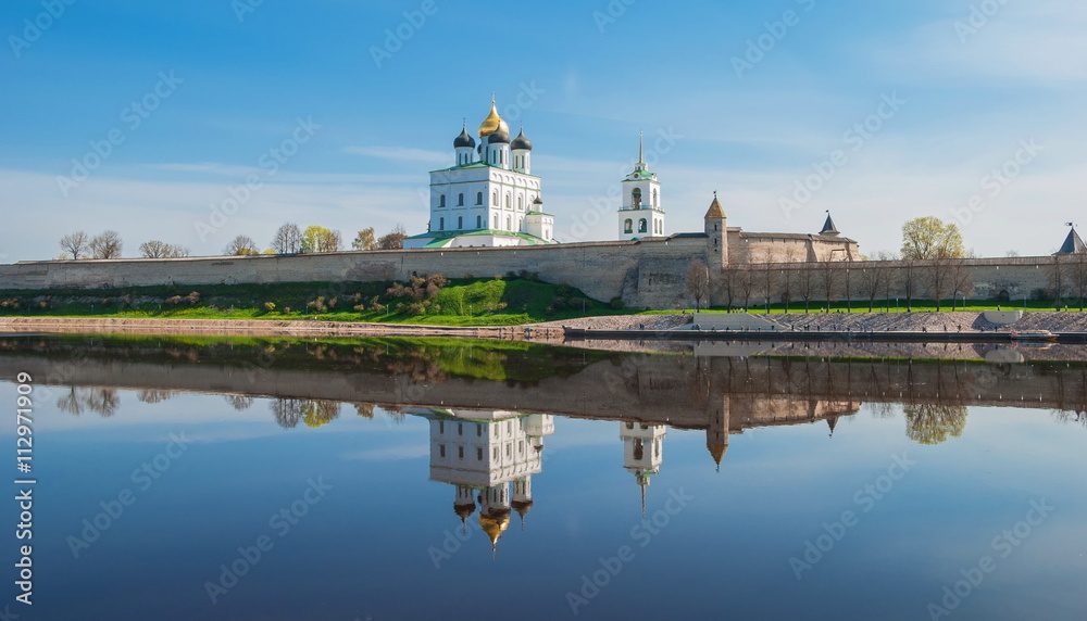 Pskov Kremlin and reflection in the river Great