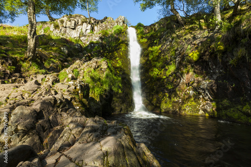Linhope Spout, waterfall. Northumberland, England, Uk. In the early morning sunlight and shadow photo