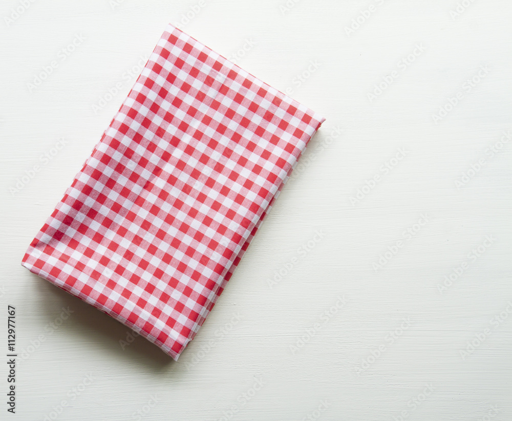 Red towel over wooden kitchen table. View from above with copy s Red towel over wooden kitchen table. View from above with copy s