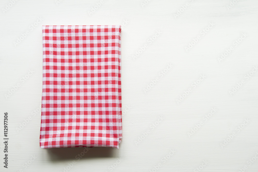 Red towel over wooden kitchen table. View from above with copy s Red towel over wooden kitchen table. View from above with copy s