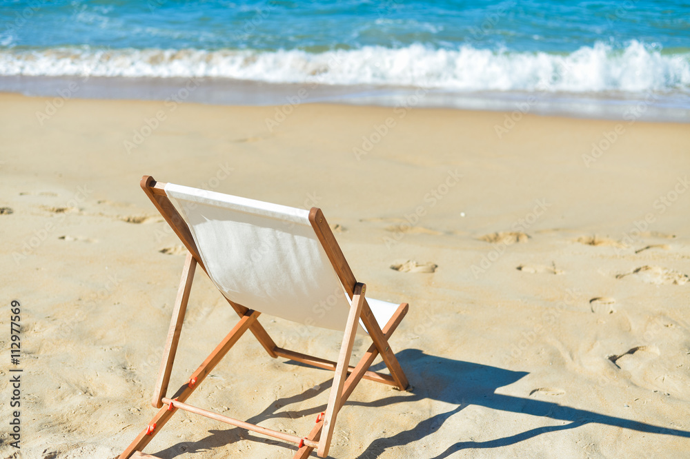 Beautiful beach landscape with chair for relaxation. Travel background Beautiful beach landscape with chair for relaxation. Travel background