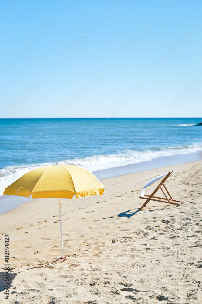 Chair and umbrella on stunning tropical beach background vacation 