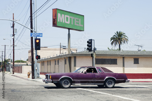 Car passing motel in Los Angeles, California