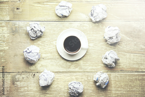 crumpled papers and coffee