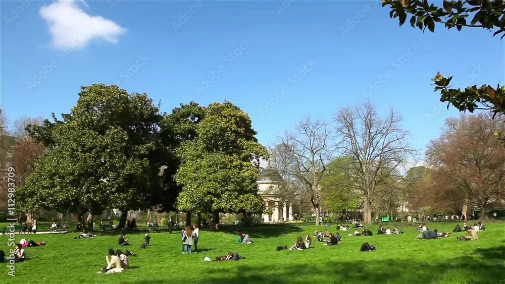 People have a rest in the Monceau park in Paris