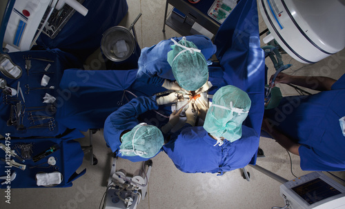 High angle view of a surgery team operating on a patient photo
