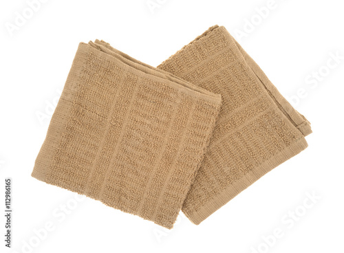 Two folded kitchen dish cloths top view isolated on a white background.