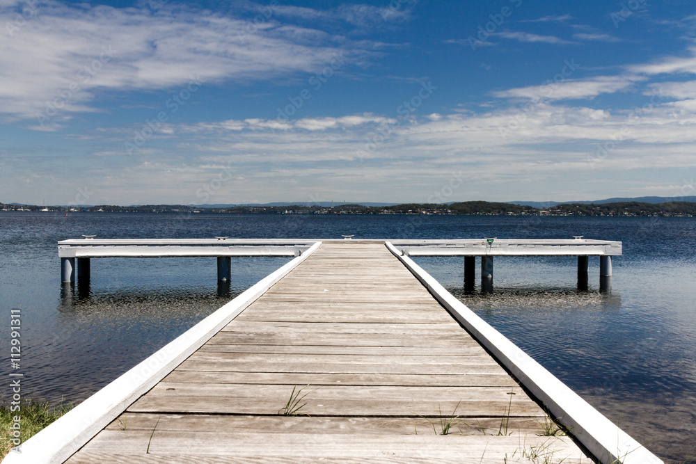 Fototapeta premium Dock at Lake on Sunny day