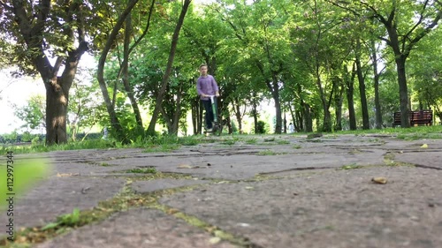 Wallpaper Mural Boy with scooter having fun in the park Torontodigital.ca