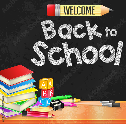 Welcome Back to School Text Written on Black Board Textured Background with Books and School Supplies
