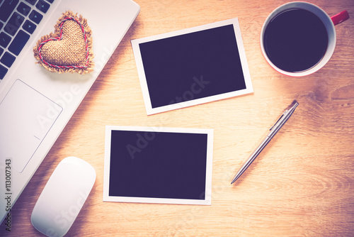 Blank photo frames on table